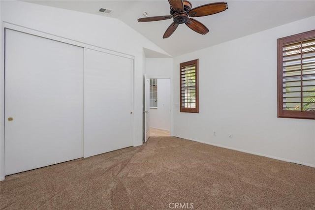24563 Calle Perla, Murrieta, CA 92562 - unfurnished bedroom with carpet flooring, lofted ceiling, a closet, and a ceiling fan