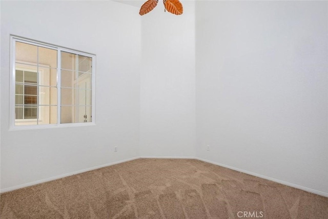 24563 Calle Perla, Murrieta, CA 92562 - spare room featuring carpet floors, baseboards, and a ceiling fan