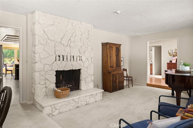 558 Paseo Companeros St, Chico, CA 95928 - living room with carpet, a textured ceiling, baseboards, and a fireplace