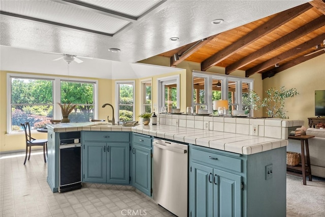 558 Paseo Companeros St, Chico, CA 95928 - kitchen featuring dishwasher, open floor plan, a sink, a ceiling fan, and blue cabinets