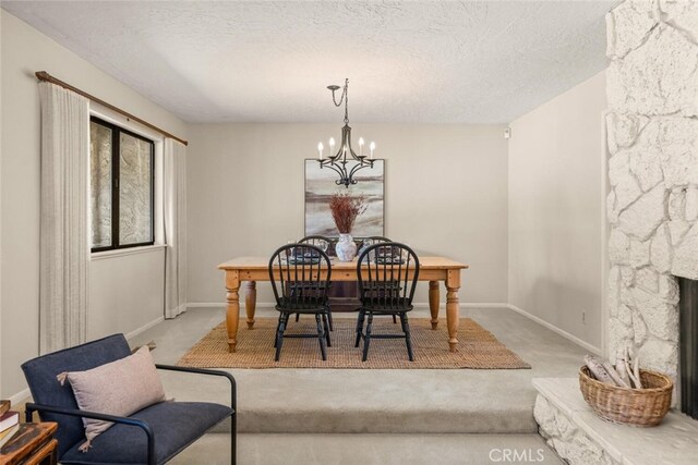 558 Paseo Companeros St, Chico, CA 95928 - carpeted dining room featuring a chandelier, baseboards, and a textured ceiling
