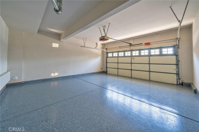 97 Twin Gables, Irvine, CA 92620 - garage featuring baseboards and a garage door opener