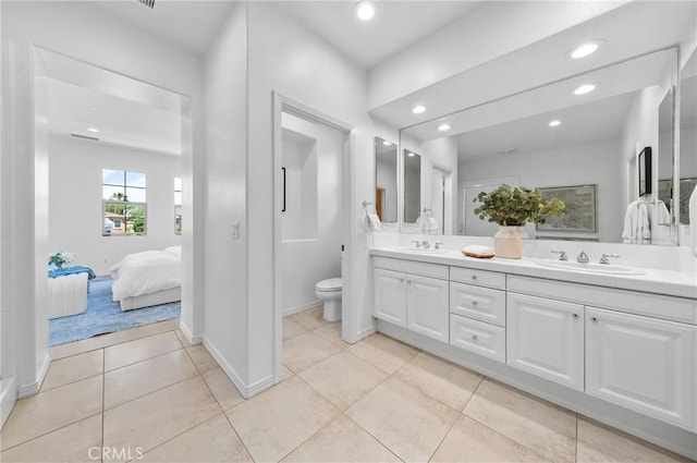 97 Twin Gables, Irvine, CA 92620 - bathroom with double vanity, toilet, recessed lighting, tile patterned floors, and ensuite bath