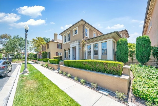 97 Twin Gables, Irvine, CA 92620 - view of front facade featuring stucco siding