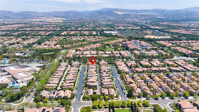 97 Twin Gables, Irvine, CA 92620 - aerial overview of property's location featuring a mountain backdrop and nearby suburban area