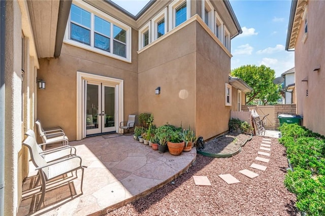 97 Twin Gables, Irvine, CA 92620 - back of house featuring french doors, stucco siding, and a patio