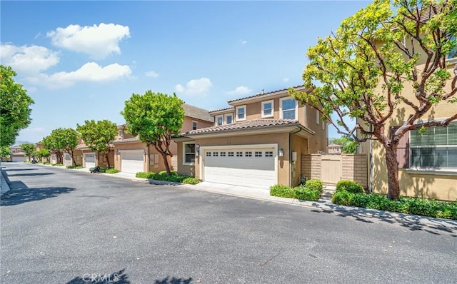 97 Twin Gables, Irvine, CA 92620 - view of front facade featuring stucco siding and a tiled roof
