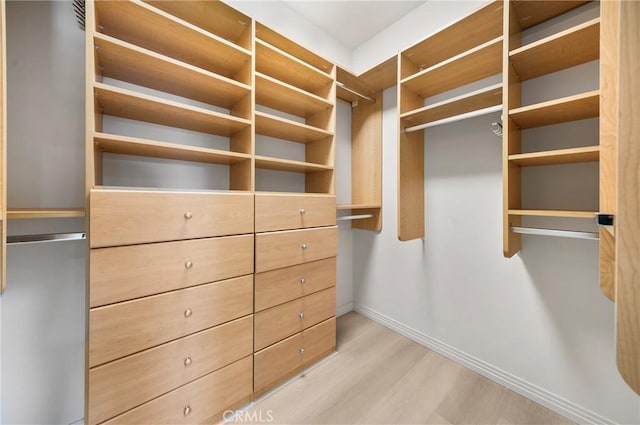 97 Twin Gables, Irvine, CA 92620 - spacious closet featuring light wood-style floors