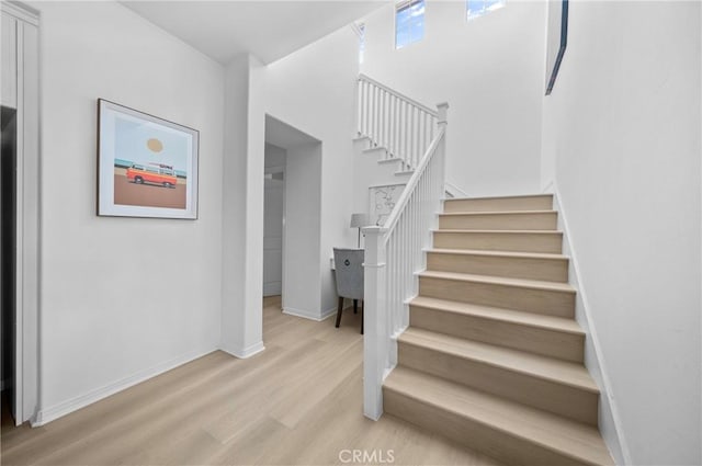 97 Twin Gables, Irvine, CA 92620 - stairway featuring wood finished floors and baseboards