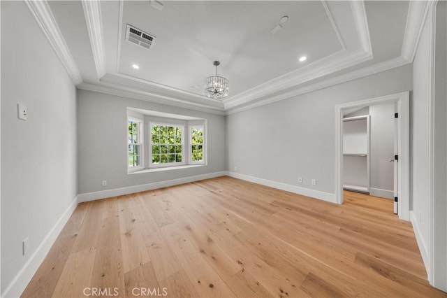 608 Arbolada Dr, Arcadia, CA 91006 - spare room with a tray ceiling, crown molding, a chandelier, light wood-type flooring, and baseboards