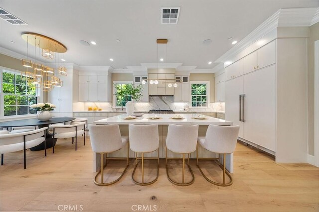 608 Arbolada Dr, Arcadia, CA 91006 - dining area with light wood finished floors, ornamental molding, recessed lighting, and a chandelier