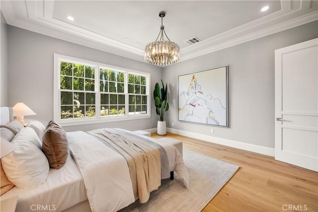 608 Arbolada Dr, Arcadia, CA 91006 - bedroom with ornamental molding, a chandelier, a tray ceiling, wood finished floors, and baseboards