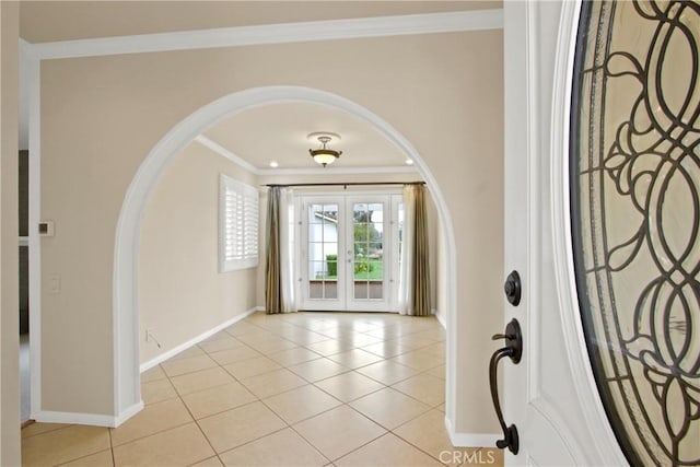 28161 Via Chabas, Mission Viejo, CA 92692 - entrance foyer with arched walkways, french doors, baseboards, crown molding, and light tile patterned floors