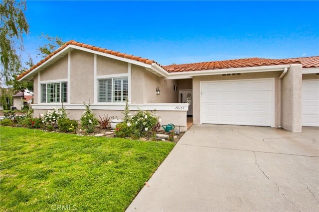 28161 Via Chabas, Mission Viejo, CA 92692 - view of front of house with an attached garage, stucco siding, driveway, and a front lawn