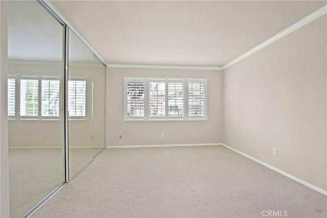 28161 Via Chabas, Mission Viejo, CA 92692 - unfurnished bedroom with ornamental molding, multiple windows, carpet, a closet, and baseboards