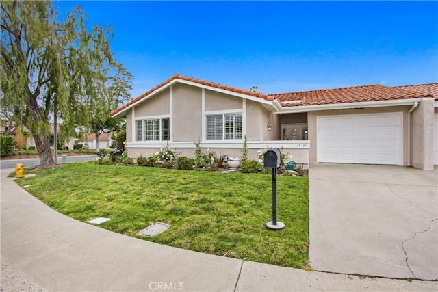 28161 Via Chabas, Mission Viejo, CA 92692 - ranch-style home with stucco siding, a tile roof, a front lawn, and driveway