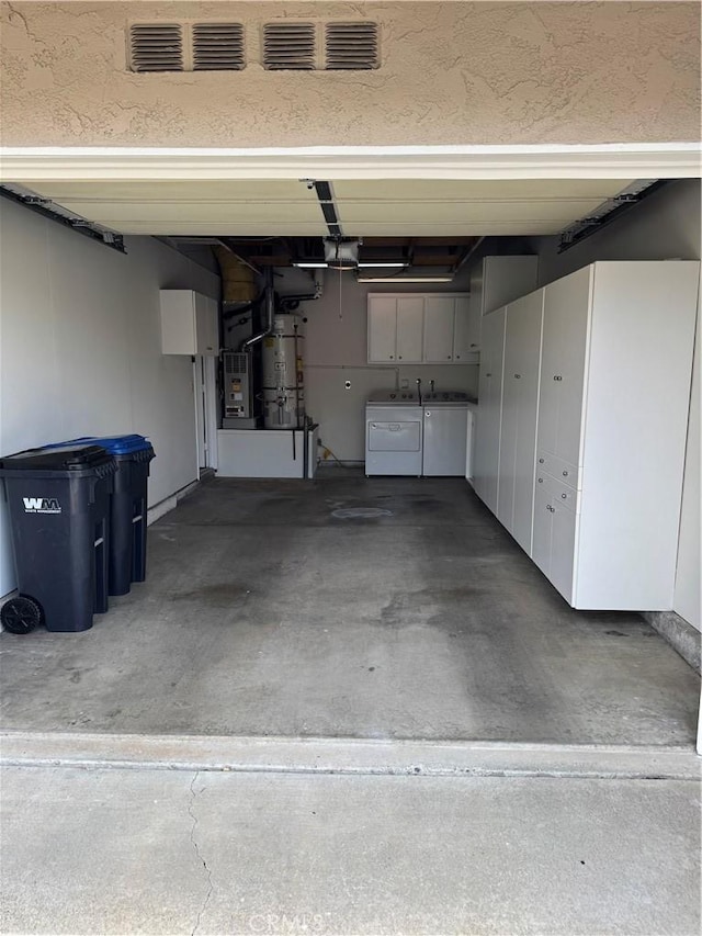 28161 Via Chabas, Mission Viejo, CA 92692 - garage with washer and clothes dryer, heating unit, secured water heater, and a garage door opener