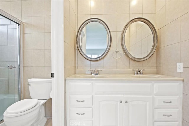 28161 Via Chabas, Mission Viejo, CA 92692 - full bathroom with tile walls, double vanity, toilet, an enclosed shower, and backsplash