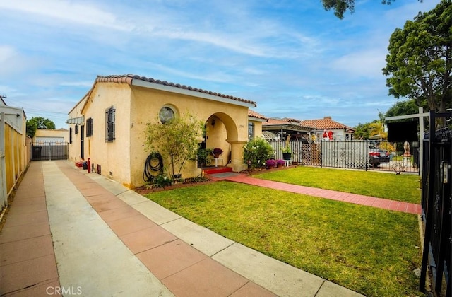 2946 Missouri Ave, South Gate, CA 90280 - mediterranean / spanish-style house featuring stucco siding, a tiled roof, and concrete driveway