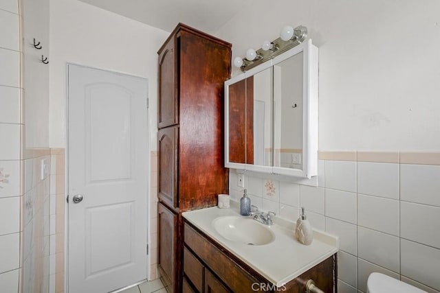 2946 Missouri Ave, South Gate, CA 90280 - bathroom featuring vanity, toilet, and tile walls
