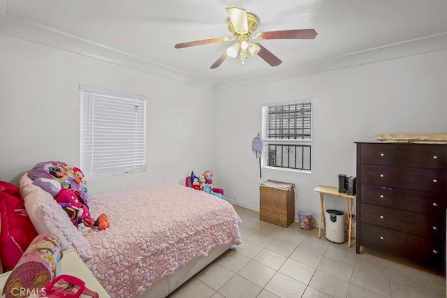 2946 Missouri Ave, South Gate, CA 90280 - bedroom featuring ornamental molding, light tile patterned floors, and ceiling fan
