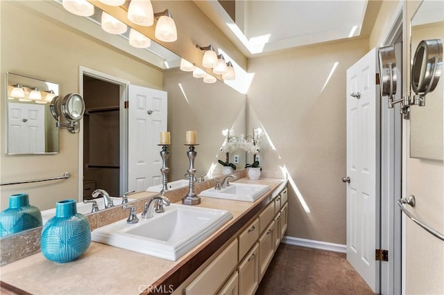 23801 Birch Ln, Mission Viejo, CA 92691 - bathroom with double vanity, a closet, and baseboards