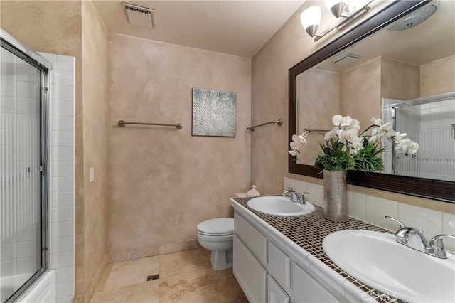23801 Birch Ln, Mission Viejo, CA 92691 - full bathroom with double vanity, toilet, tile patterned floors, and baseboards