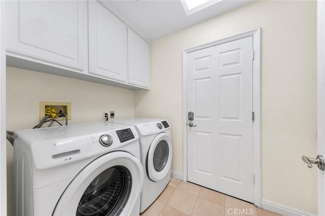 2712 N Roxbury St, Orange, CA 92867 - washroom featuring cabinet space, baseboards, washing machine and clothes dryer, and light tile patterned floors