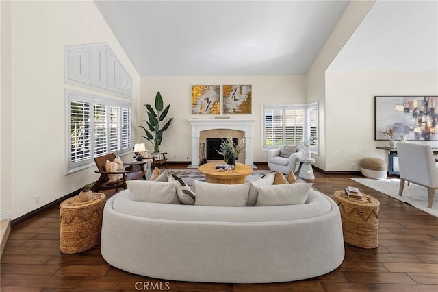 2712 N Roxbury St, Orange, CA 92867 - living area featuring a premium fireplace, high vaulted ceiling, wood finished floors, and baseboards