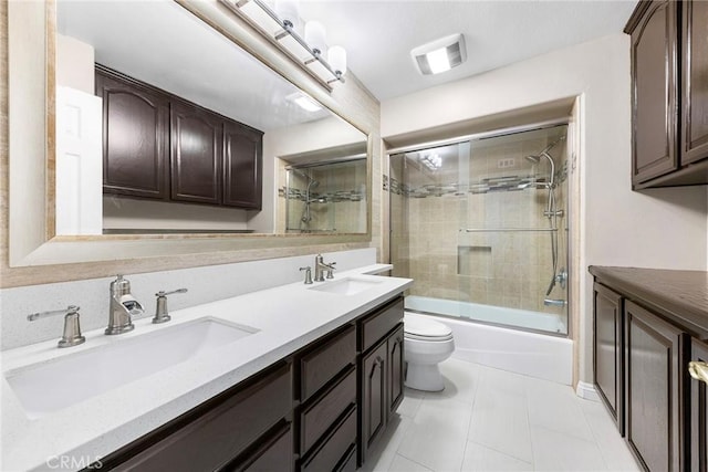2712 N Roxbury St, Orange, CA 92867 - bathroom featuring toilet, double vanity, and combined bath / shower with glass door