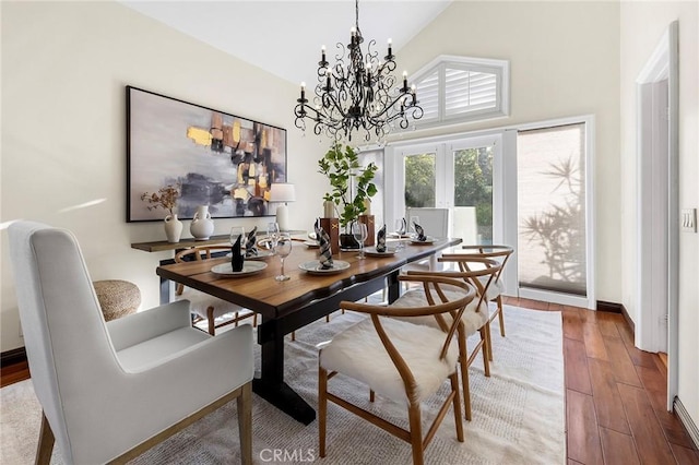 2712 N Roxbury St, Orange, CA 92867 - dining space featuring high vaulted ceiling, wood finished floors, a chandelier, and french doors