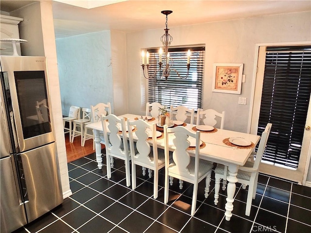 251 W Markland Dr, Monterey Park, CA 91754 - dining space with a chandelier and dark tile patterned flooring