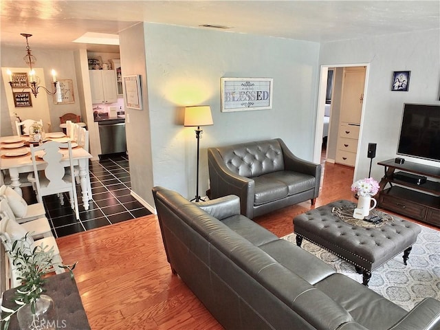 251 W Markland Dr, Monterey Park, CA 91754 - living area with a chandelier, wood finished floors, and baseboards