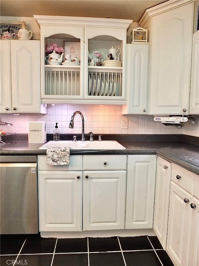 251 W Markland Dr, Monterey Park, CA 91754 - kitchen featuring dark countertops, stainless steel dishwasher, and dark tile patterned floors