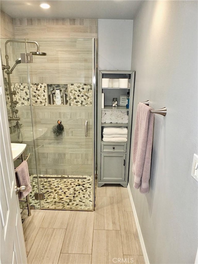 251 W Markland Dr, Monterey Park, CA 91754 - bathroom with a shower stall, wood finished floors, and baseboards