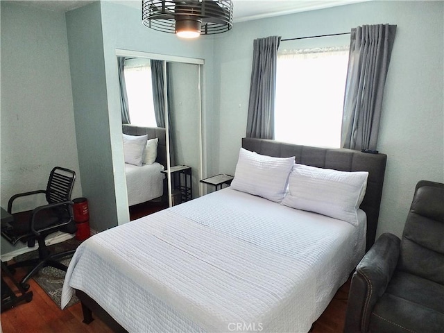 251 W Markland Dr, Monterey Park, CA 91754 - bedroom featuring multiple windows, wood finished floors, and a closet