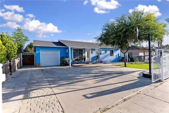 4776 E Lowe Ave, Fresno, CA 93702 - ranch-style house with an attached garage, concrete driveway, stucco siding, and a gate