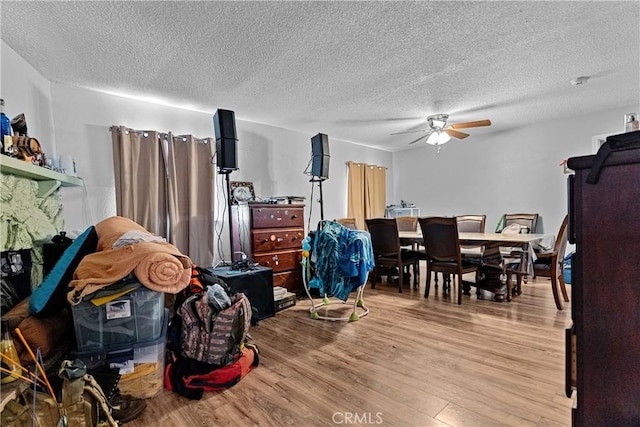 4776 E Lowe Ave, Fresno, CA 93702 - living room featuring light wood-style flooring, ceiling fan, and a textured ceiling