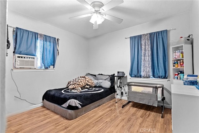 4776 E Lowe Ave, Fresno, CA 93702 - bedroom featuring wood finished floors, cooling unit, baseboards, and ceiling fan
