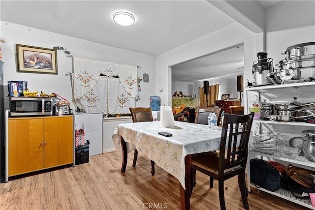 4776 E Lowe Ave, Fresno, CA 93702 - dining space with light wood-type flooring