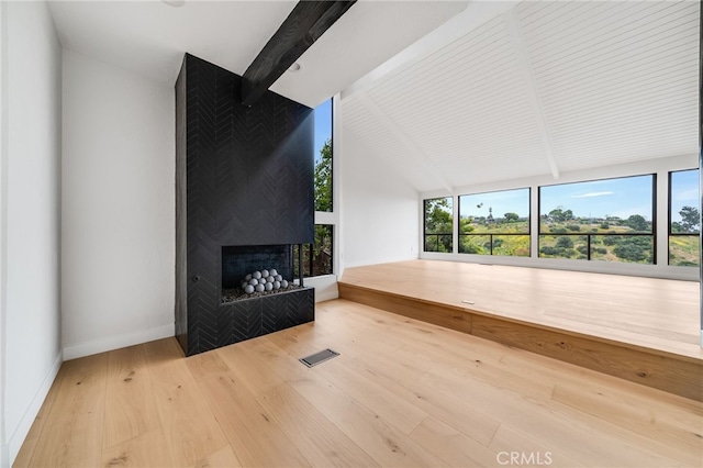 1450 Terrace Way, Laguna Beach, CA 92651 - unfurnished living room featuring hardwood / wood-style floors, a multi sided fireplace, and baseboards