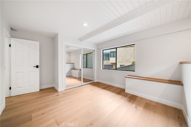 1450 Terrace Way, Laguna Beach, CA 92651 - unfurnished bedroom with light wood-type flooring, recessed lighting, a closet, and beam ceiling