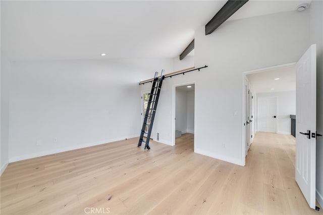 1450 Terrace Way, Laguna Beach, CA 92651 - unfurnished living room featuring light wood-style floors, recessed lighting, beam ceiling, baseboards, and a barn door