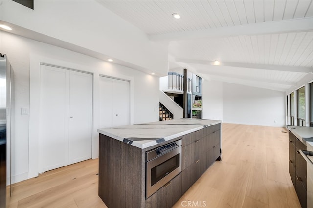 1450 Terrace Way, Laguna Beach, CA 92651 - kitchen with light wood-type flooring, dark brown cabinets, open floor plan, appliances with stainless steel finishes, and recessed lighting
