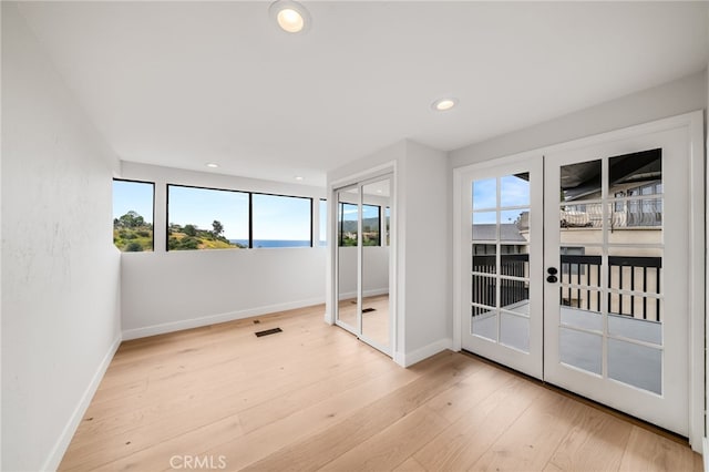 1450 Terrace Way, Laguna Beach, CA 92651 - unfurnished bedroom featuring multiple windows, baseboards, wood finished floors, and recessed lighting