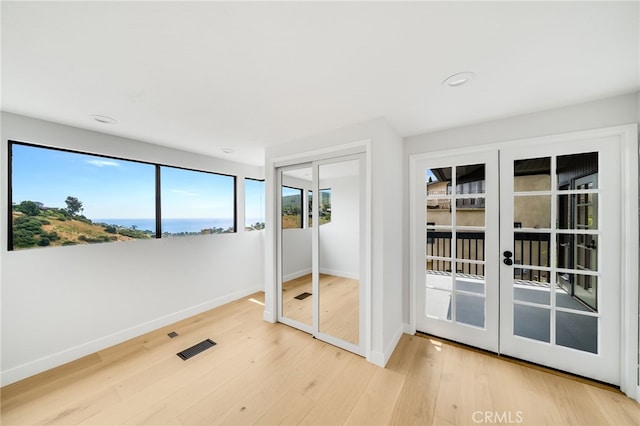 1450 Terrace Way, Laguna Beach, CA 92651 - unfurnished bedroom with french doors, wood finished floors, and recessed lighting