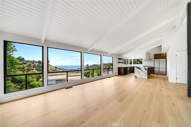 1450 Terrace Way, Laguna Beach, CA 92651 - unfurnished living room with high vaulted ceiling, beam ceiling, light wood-style floors, and plenty of natural light
