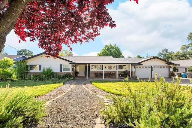 180 La Mirada Ave, Oroville, CA 95966 - ranch-style home featuring a garage, a front yard, a porch, asphalt driveway, and brick siding