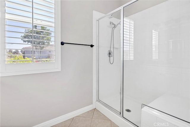 243 Firestone, Hemet, CA 92545 - bathroom featuring a stall shower, tile patterned floors, and baseboards