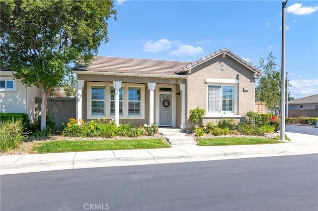 243 Firestone, Hemet, CA 92545 - view of front facade featuring a tiled roof and stucco siding